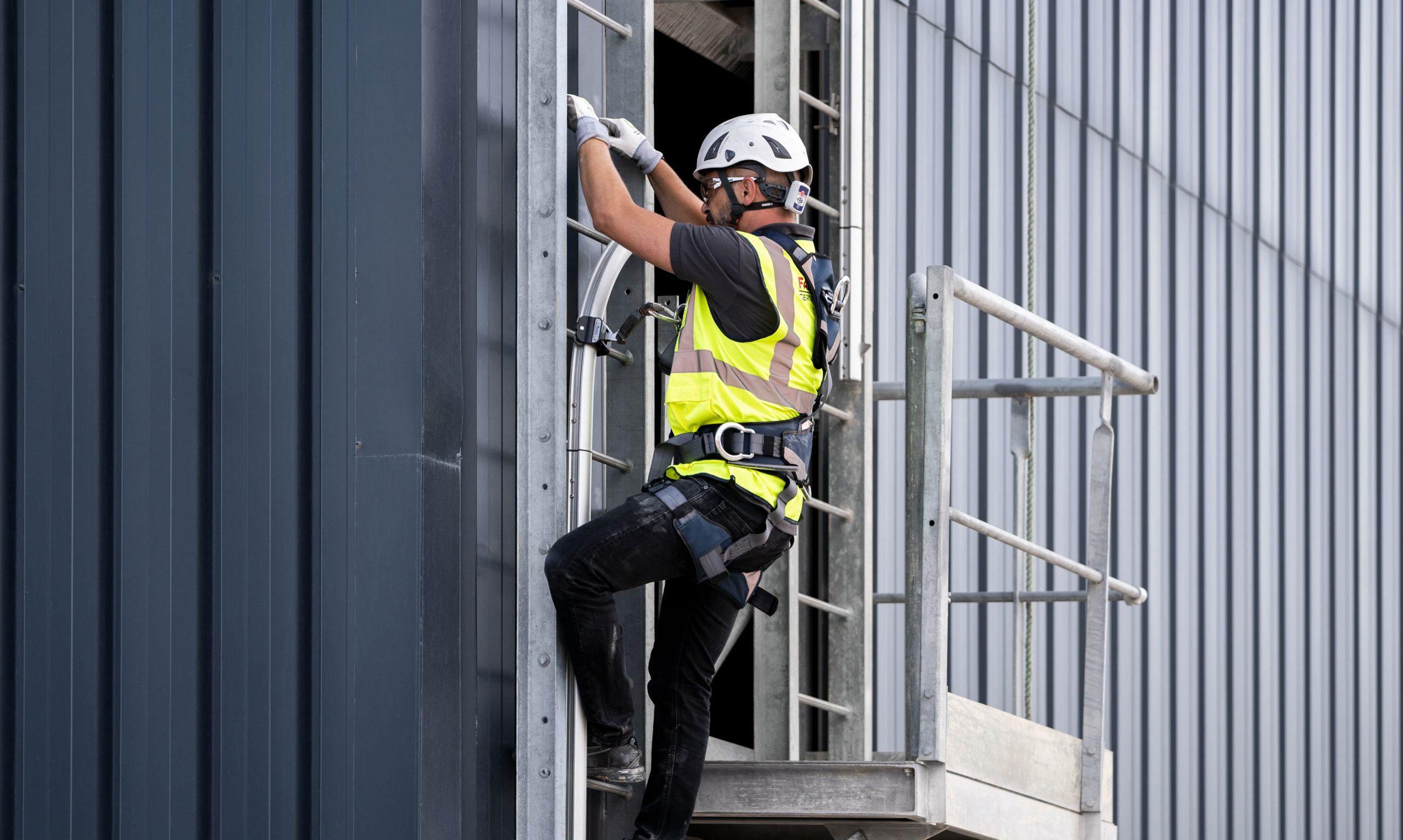 Man climbing Fall Arrest Access Ladder